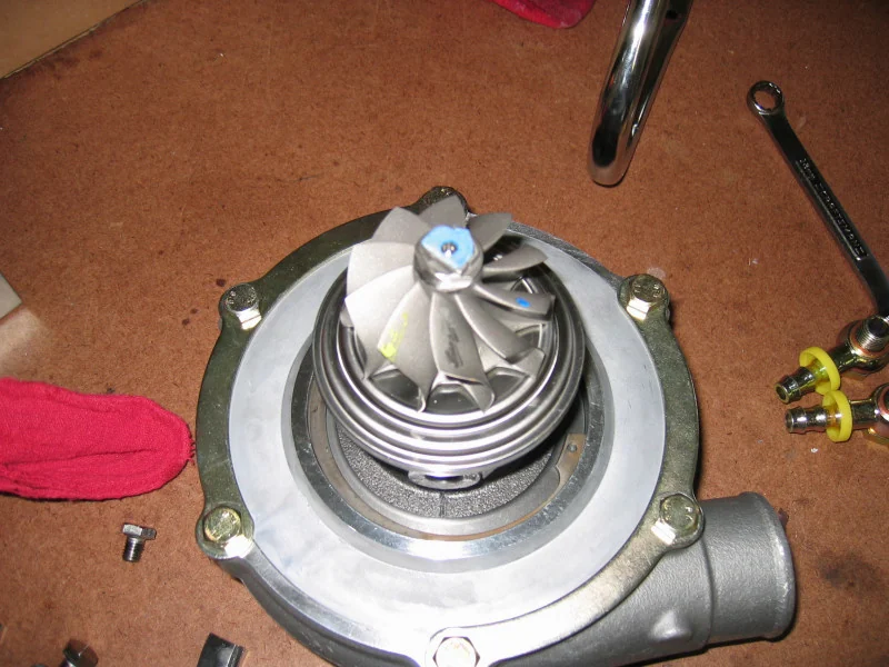 Garrett GT30 turbine wheel exposed with the turbine housing removed — real reference photograph, not the specific N54 TD03/TD04 part
